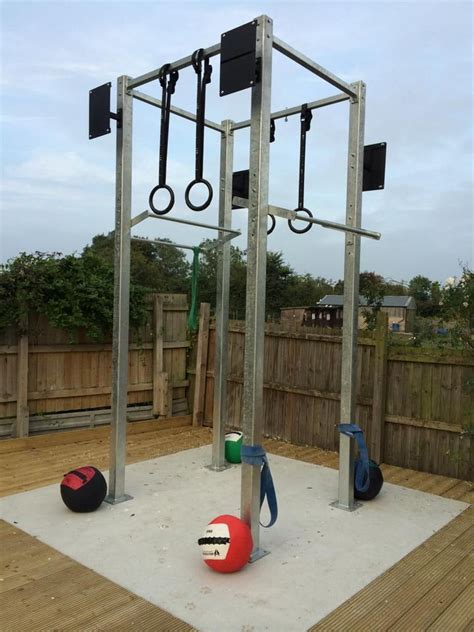 an outdoor gym with several different types of equipment on the ground ...