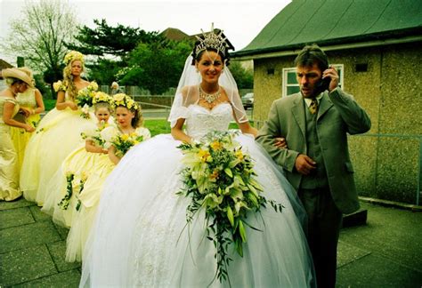 This woman is an Irish Traveler having an ornate wedding in an extravagant white wedding dress with