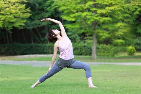 Portrait of Japanese Woman Doing Yoga Exercise Outdoor Stock Photo - Image of frog, meditating ...