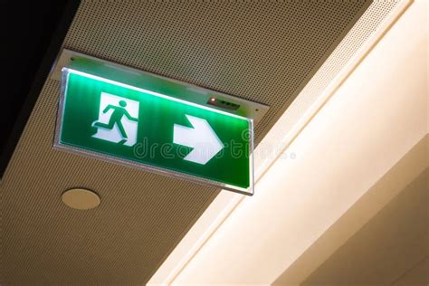 Fire Exit ,green Emergency Exit Sign Stock Photo - Image of leading ...