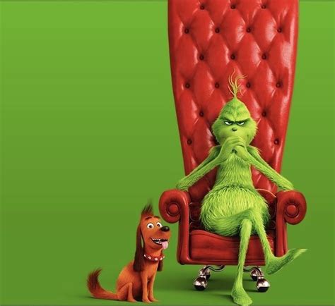 the grinch sitting in a red chair next to a dog on a green background