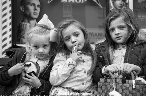 Life on the road: Young girls smoke cigarettes while others get glammed-up in striking images of ...