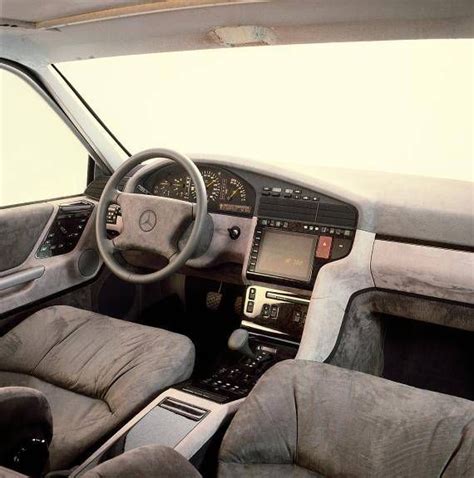 the interior of a car with grey leather seats and dashboard, steering wheel and dash board