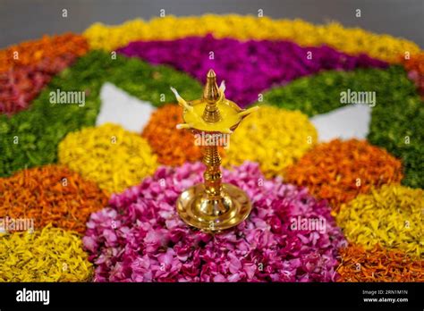 Onam festival, oil lamp, brass lamp, floral rangoli, concept, conceptual, table top, Kerala ...
