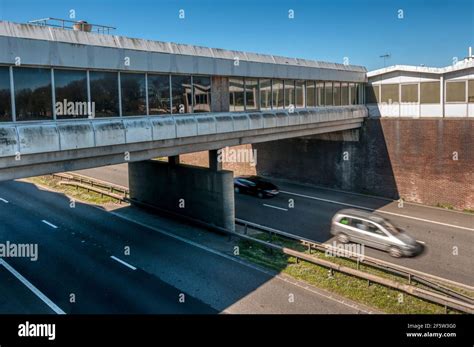 Concrete bridge carrying services over the M2 motorway at the Moto Medway services near Farthing ...