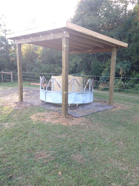 Perfect round bale holder for my front pasture. Thanks to my perfect husband. 12x12 roof, 8' hay ...