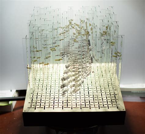 A Rotating Glass Sculpture Containing Four 'Hidden' Anamorphic ...