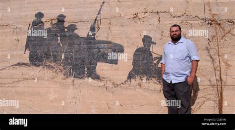 Breaking the Silence founder Yehuda Shaul posing in front of a wall Stock Photo - Alamy