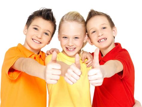 happy children with thumbs up gesture - จัดฟัน ดัดฟัน ทันตกรรม