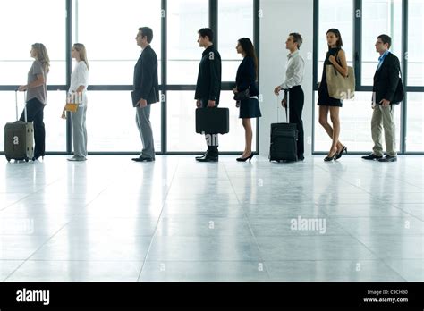 Business people standing in line Stock Photo - Alamy