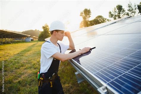 Young adult doing professional training on solar panels plant Stock Photo | Adobe Stock