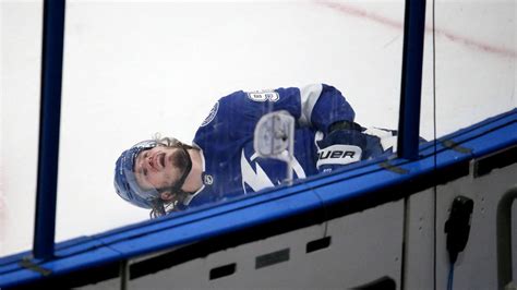 Lightning’s Mikhail Sergachev leaves game after hit into boards