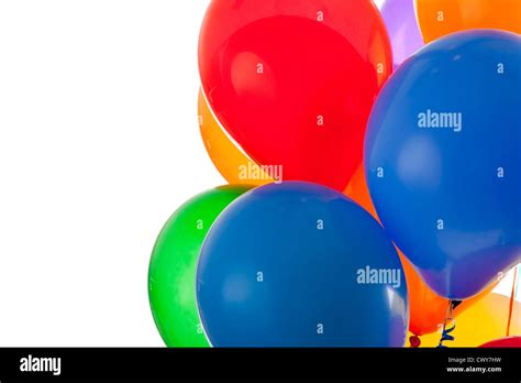 red, blue, green, orange, yellow, and purple balloons on a white background with copy space ...