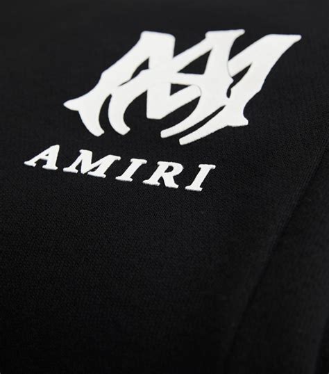 AMIRI black Logo Sweatpants | Harrods UK | ? logo, Black logo, Tshirt logo