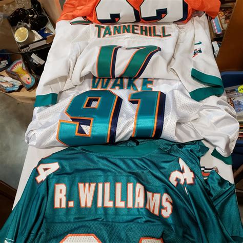 4 MIAMI DOLPHINS NFL JERSEYS - Big Valley Auction