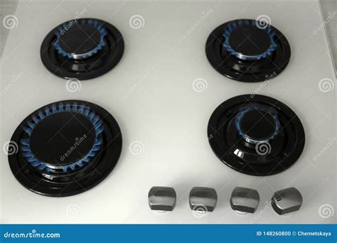 Gas Burners with Blue Flame on Stove Stock Photo - Image of circular ...