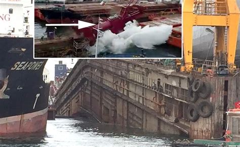 Floating dock with 2 ships inside broke in two, crane collapsed, ships taking on water