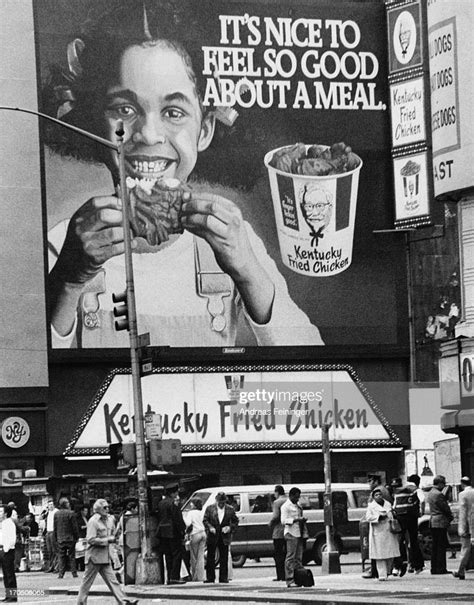 A billboard over a Kentucky Fried Chicken fast food outlet in New... News Photo - Getty Images