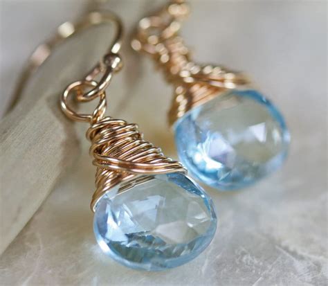 Blue Topaz Earrings in Gold