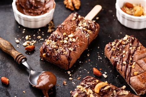 Premium Photo | Chocolate ice cream popsicle with nut