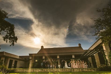 a group of people standing in front of a house