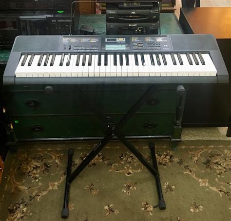 Uhuru Furniture & Collectibles: Casio Keyboard with Stand - $95 SOLD