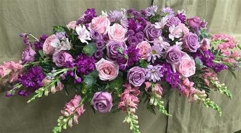 Timeless- purple standard roses, pink garden roses, purple stock, purple button mum daisies, pu ...