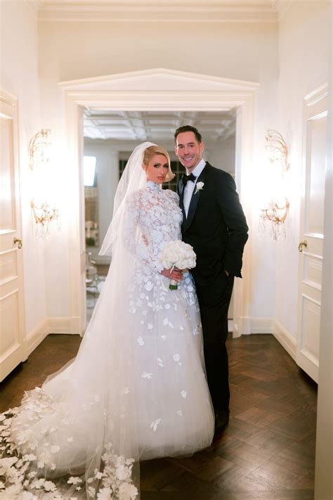 Paris Hilton wore a custom Oscar de la Renta wedding dress with sheer lace that was reminiscent ...