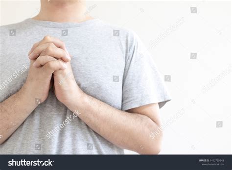 Man Praying Hands Together Stock Photo 1412755643 | Shutterstock