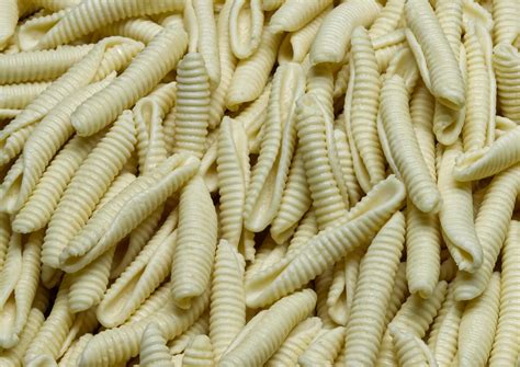 Uncooked Italian Maccheroni al pettine pasta background. 14507925 Stock Photo at Vecteezy