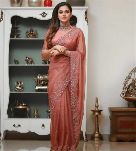 Anusree Nair exudes elegance in a peach saree-blouse combo!