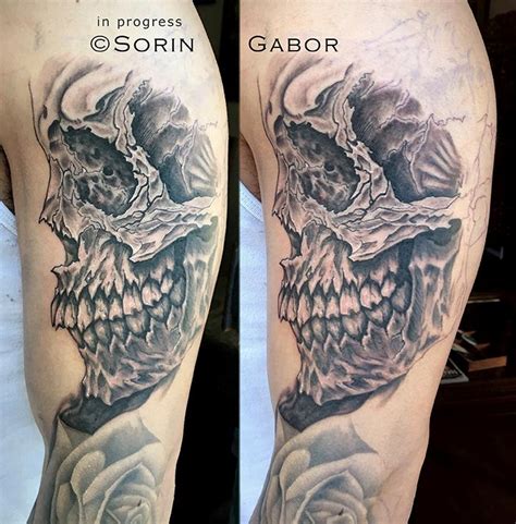 realistic and graphic black and gray sleeve tattoo in progress skull detail by Sorin Gabor : Tattoos