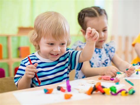 Happy Children Doing Arts and Crafts. Kids in Kindergarten. Stock Image - Image of daycare ...