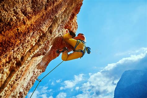 Rock Climber Climbing Up a Cliff Stock Image - Image of height, climbing: 51403473