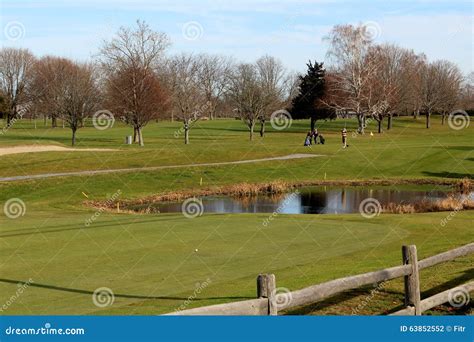 Golf Course Water Hazard With Golfers Stock Photo - Image of ball, golfing: 63852552