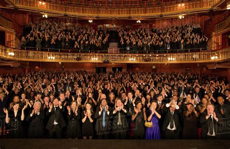 Audience applauding in theater - Stock Photo - Dissolve