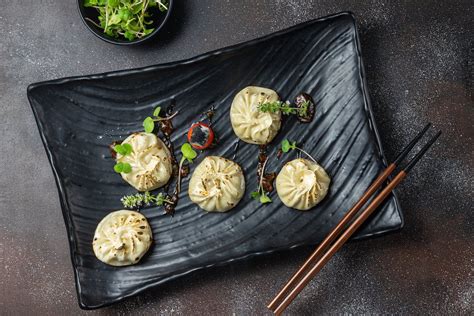 Momo Dish on a Black Plate · Free Stock Photo