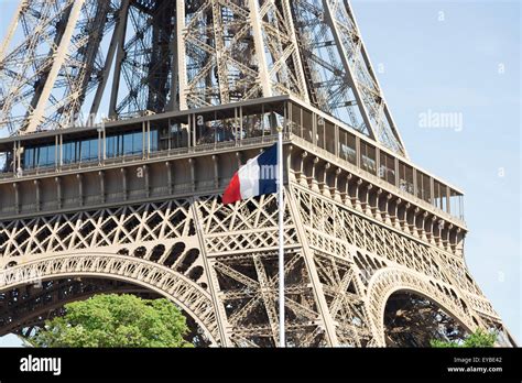 The Eiffel Tower in Paris, France with the french flag in front of it ...