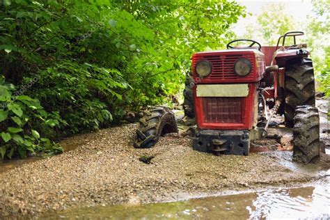 Farm tractor stuck in mud | Tractor stuck in the mud — Stock Photo © Xalanx #77717982