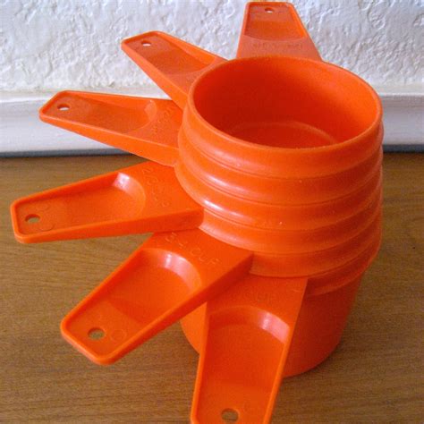 Vintage Tupperware Orange Measuring cups set by nellsvintagehouse