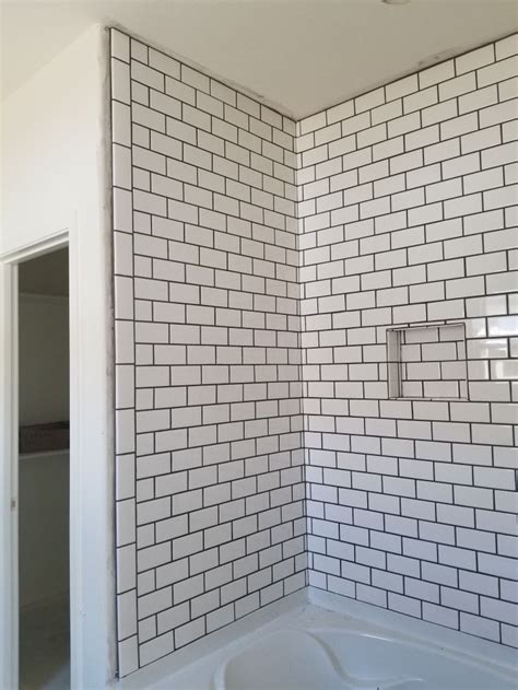 White subway tile with gray grout