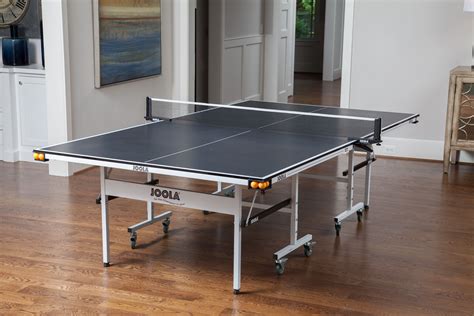 The JOOLA Rapidplay 150 Table Tennis Table features a 15mm features 4 ball holders, each of ...