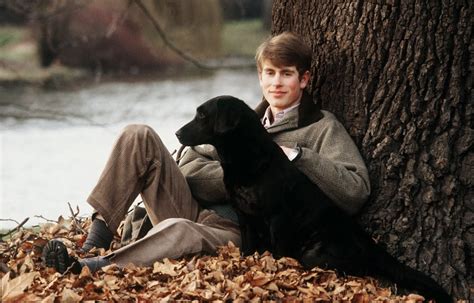 A young Prince Edward posed with his Black Labrador, Frances, in the ...