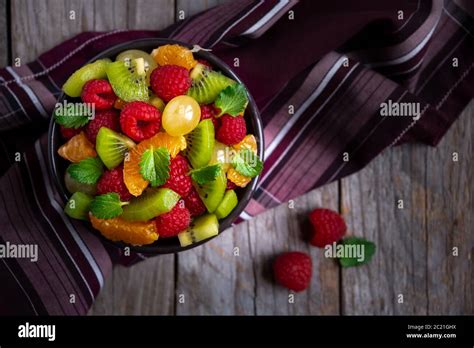 Delicious fruit salad with with raspberry and other fruit Stock Photo ...