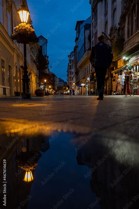 Man walking alone at night Stock Photo | Adobe Stock