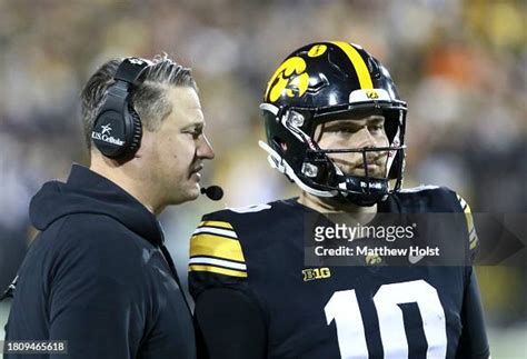 Offensive coordinator Brian Ferentz of the Iowa Hawkeyes talks with ...