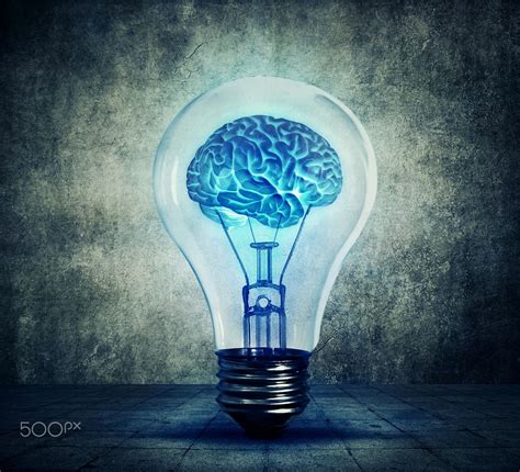 Lightbulb brain - Human brain glowing inside a light bulb. Blue shining ...