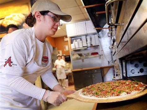 Mayor helps break ground on pizza parlour expansion | National Post