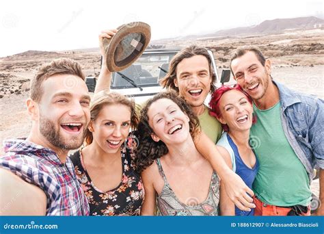 Group of Travel Friends Taking Selfie in the Desert during a Roadtrip ...