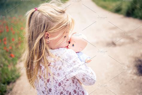 little girl with doll | High-Quality Stock Photos ~ Creative Market